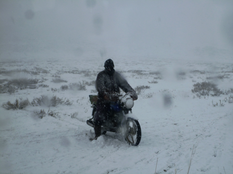 Mongolia nomad motorcycle snow